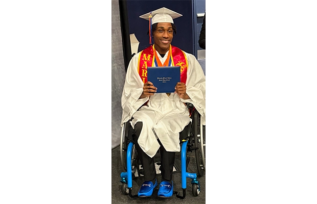 Young person in a wheelchair graduating
