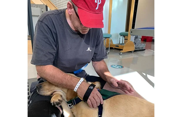 Man spoiling his dog