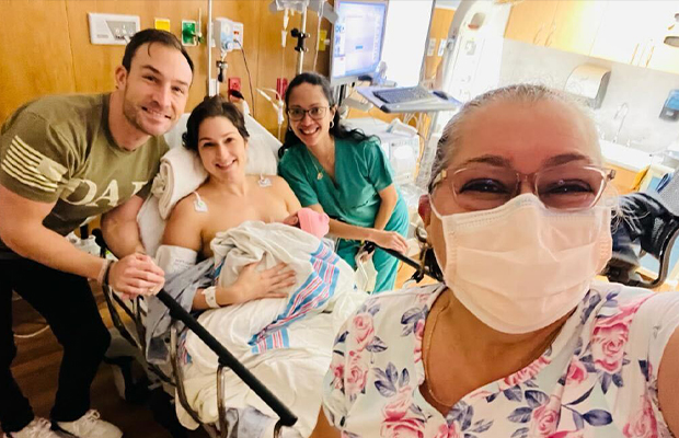 family reunited in the hospital, receiving a newborn