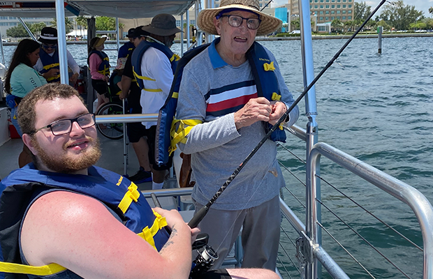 men posing on boat
