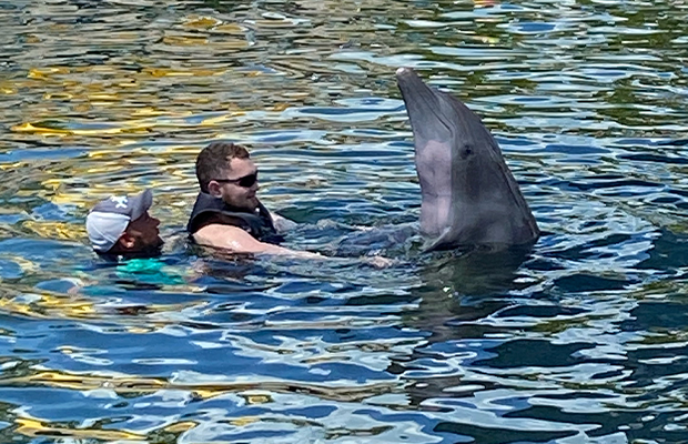 men playing with dolphin