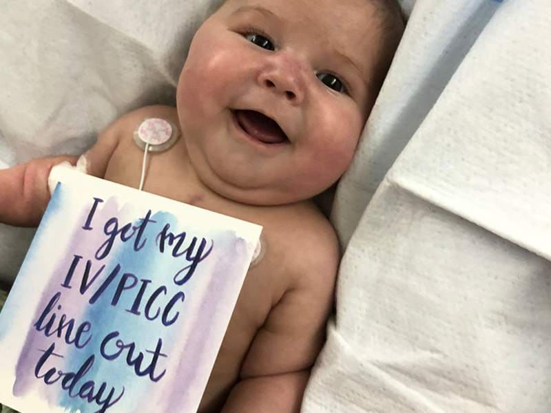 Baby intubated on hospital stretcher