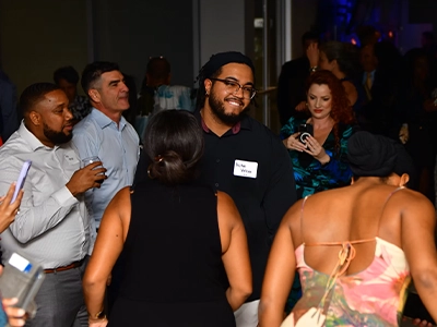 group of people dancing and sharing during a formal event