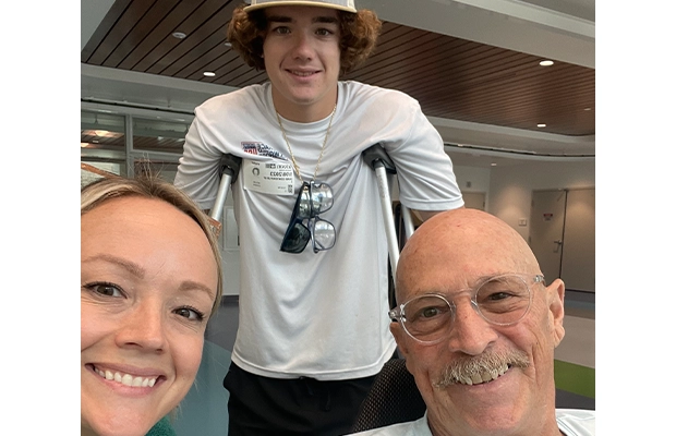 3 people posing and smiling at the camera