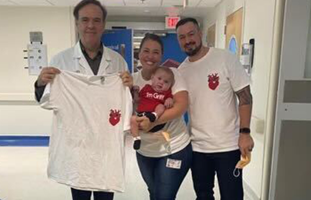 Parents with their baby next to the doctor