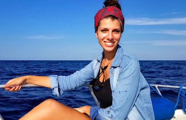 photo of woman by the sea