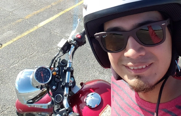 selfie of man next to his motorcycle