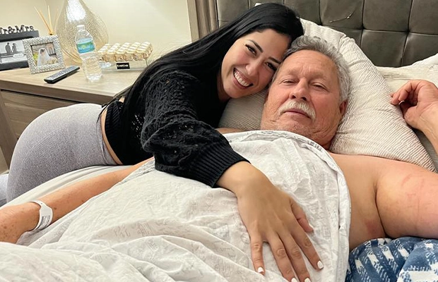 Man in bed next to woman