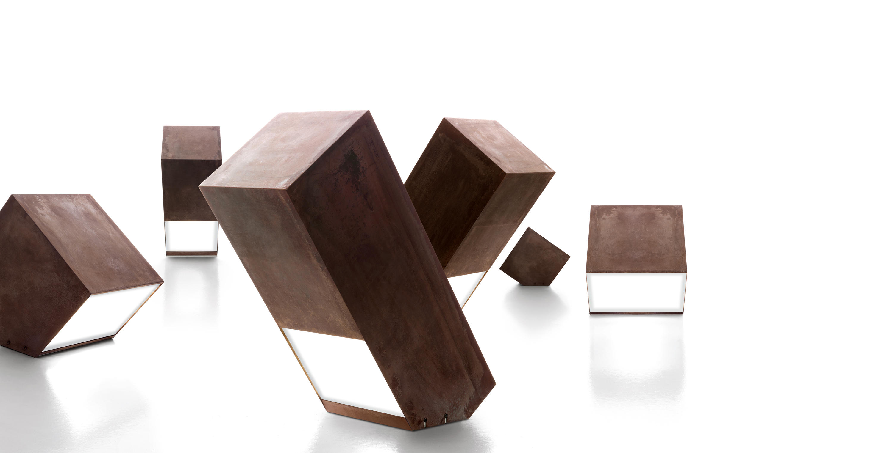 Abstract copper-toned geometric blocks arranged on a white background
