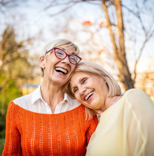 two women laughing together