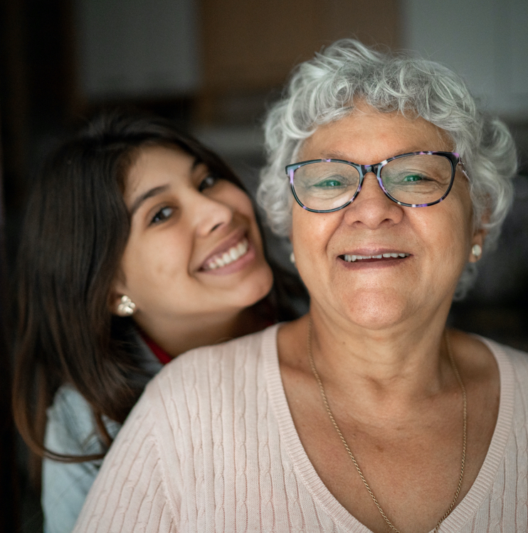 mom and daughter smiling