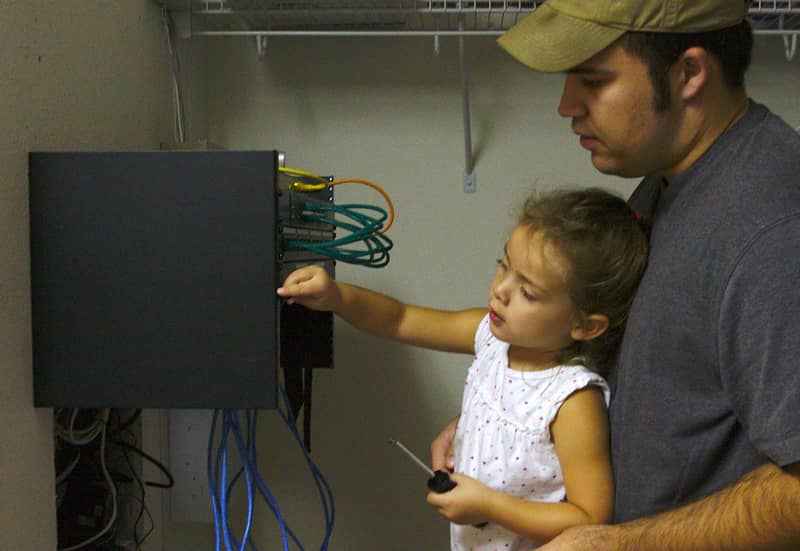 My daughter Allison and I installing patch panels.