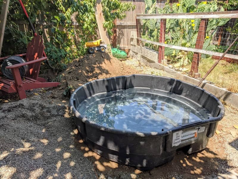 Eight inches of hardpan later the trough sits level ready for further work.