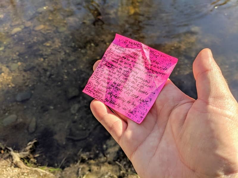 The Post-It note of dreams sits in my hand along the river bank.