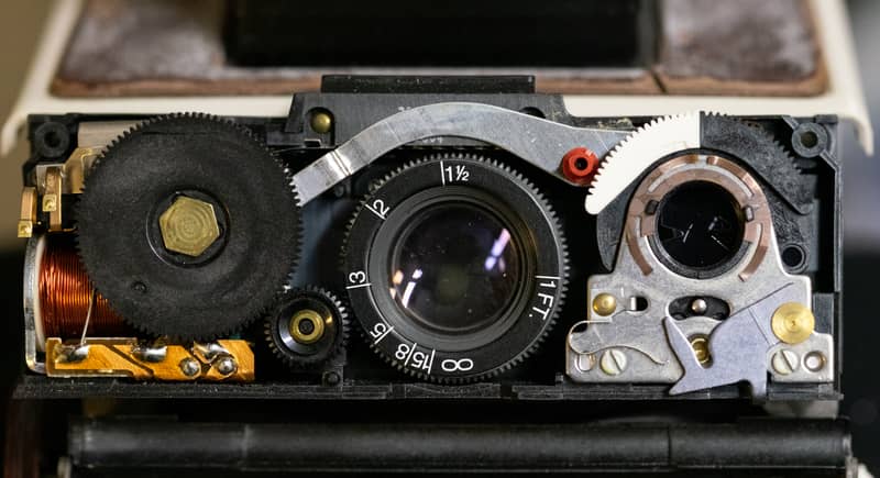 The shutter front housing removed reveals the SX-70 shutter assembly.