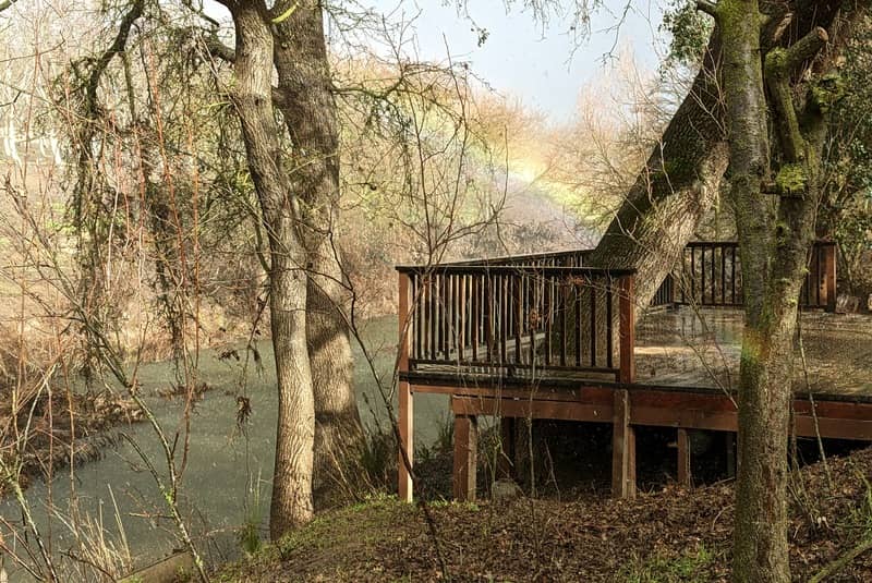 A rainbow appears in a thunderstorm over Dry Creek near Waterford, California while mending fences damaged by flooding.