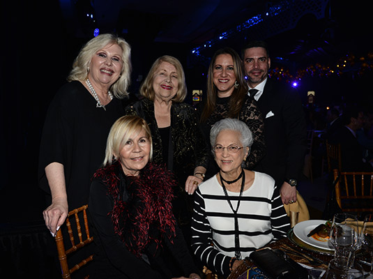 A group of people smiling at the camera