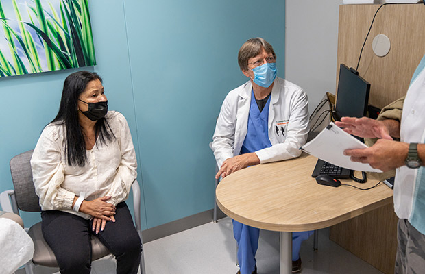 A medical professional and woman in a medical office