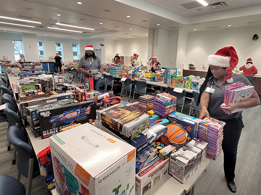 People placing toys on tables