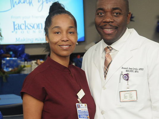 Man and woman smiling at camera