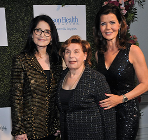 three women posing for the camera