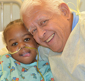 girl smiling next to her doctor