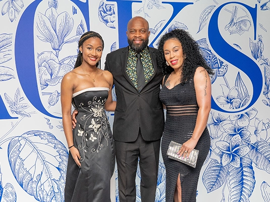 Three people posing at the Jackson Health gala