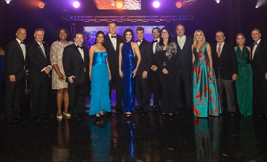 group of 15 people dressed to the nines during formal event