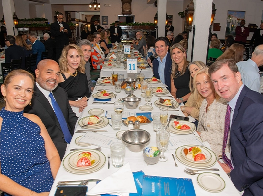 people sharing a dinner during a formal event