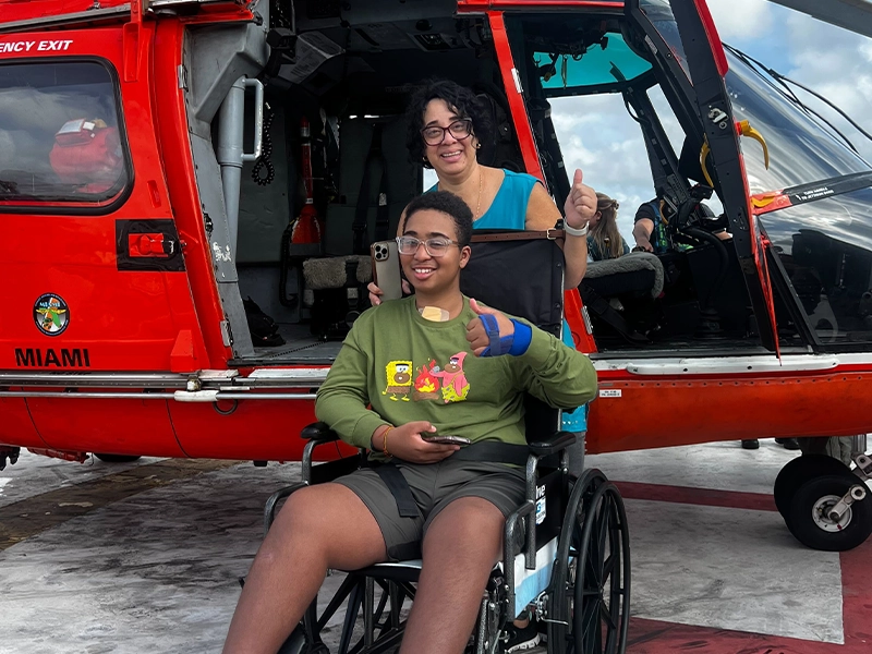boy in a wheelchair with his mother