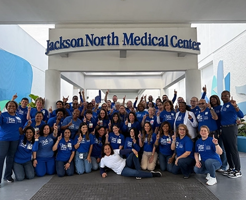 large group of people wearing blue t-shirts