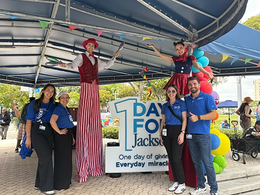 People wearing blue Jackson Health t-shirts during the event