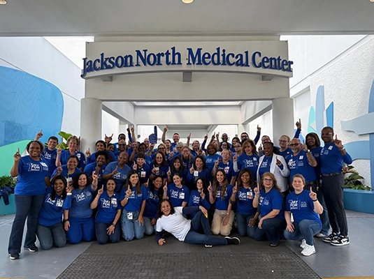 large group of people wearing blue t-shirts