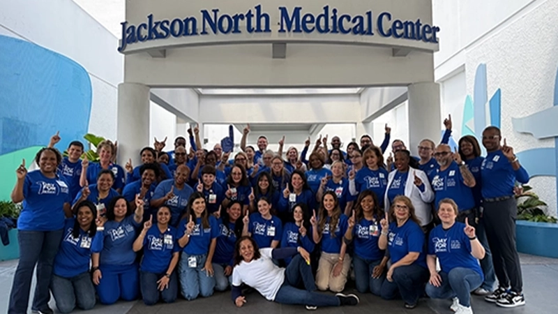 large group of people wearing blue t-shirts