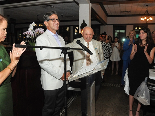 two people talking into a microphone