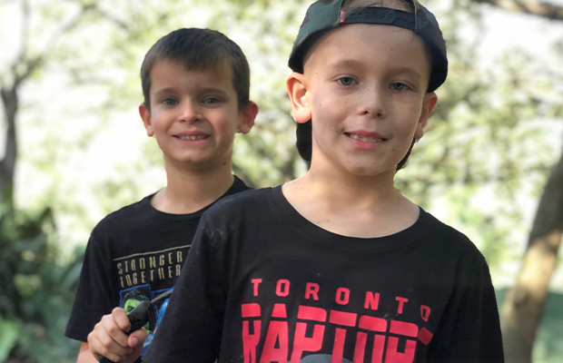 two children posing for the camera