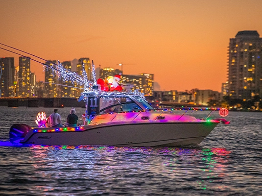boat with LED lighting, under an orange sunset