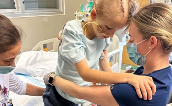 child doing therapy with his nurse