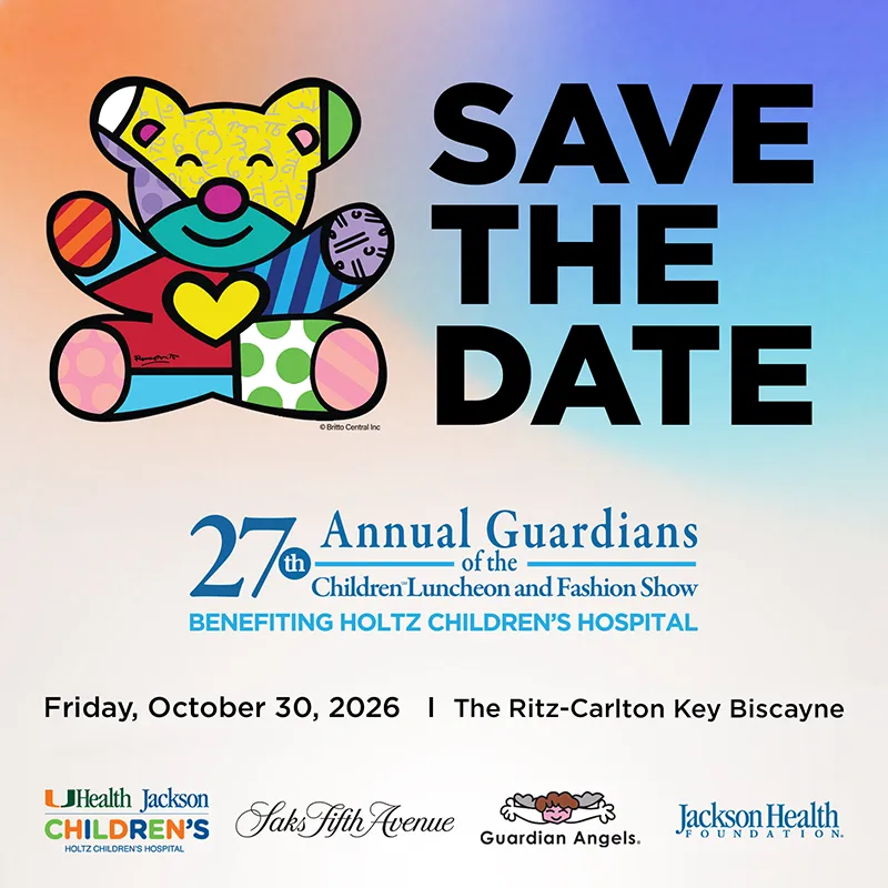 Save the Date graphic featuring a colorful pop-art style teddy bear illustration by Romero Britto. Text reads: 27th Annual Guardians of the Children Luncheon and Fashion Show, Benefiting Holtz Children's Hospital. Friday, October 30, 2026 at The Ritz-Carlton Key Biscayne. Logos for UHealth Jackson Children's Holtz Children's Hospital, Saks Fifth Avenue, Guardian Angels, and Jackson Health Foundation appear at the bottom.