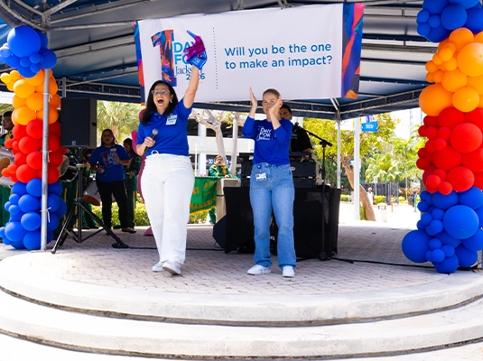 Two women on a stage during a Jackson event.