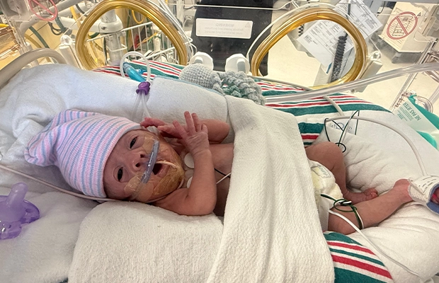 A small baby in an incubator