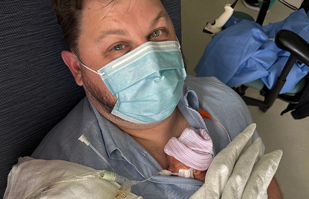 Man lifting a baby