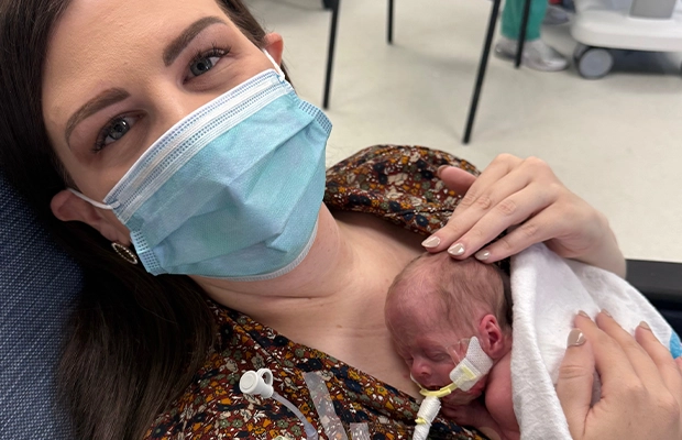 woman lifting a baby