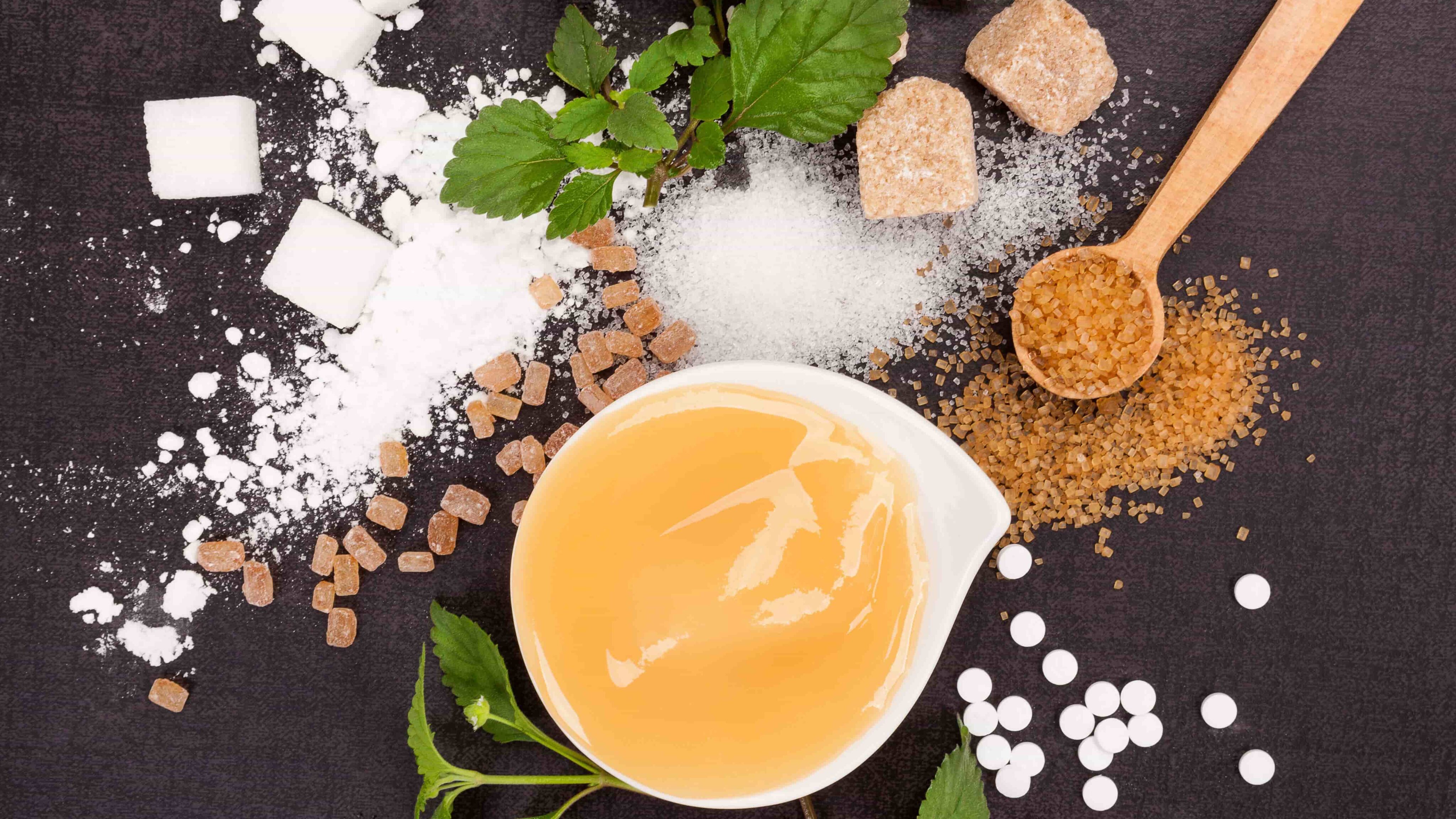 Several types of sugar and sweeteners on a countertop