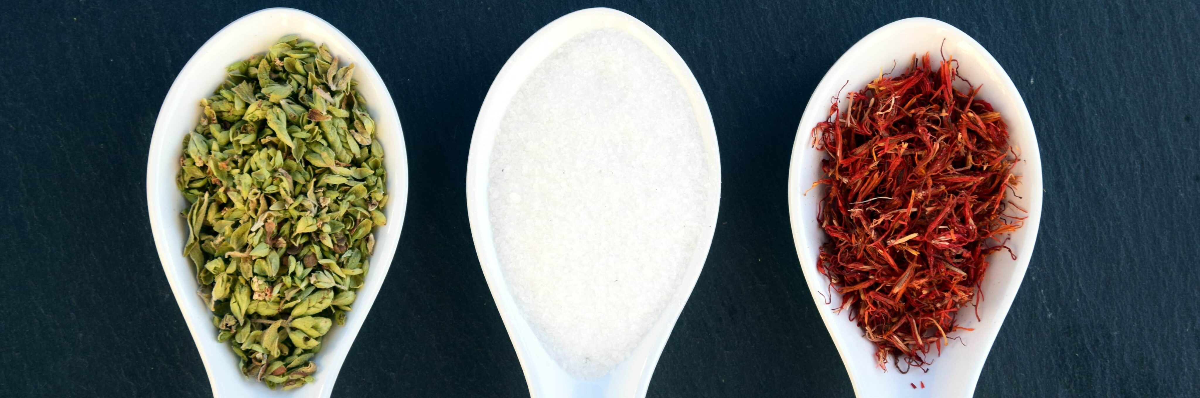 Ceramic spoons with salt and spices