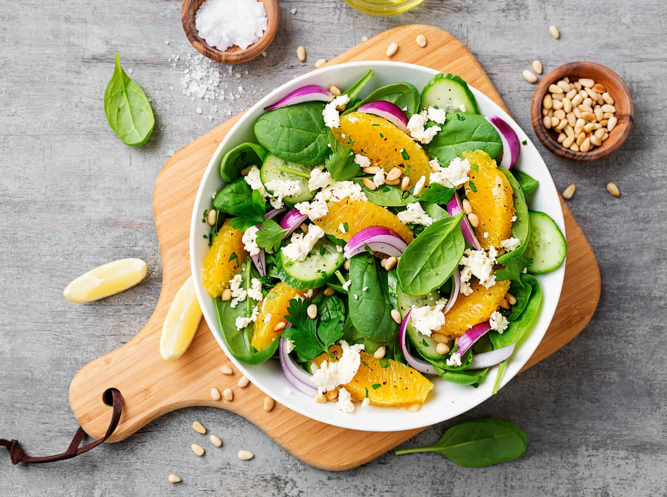 Spinach and orange salad in a deep plate.