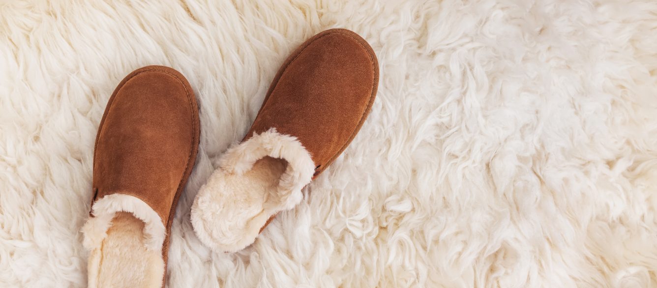 Slippers on a warm fur rug.