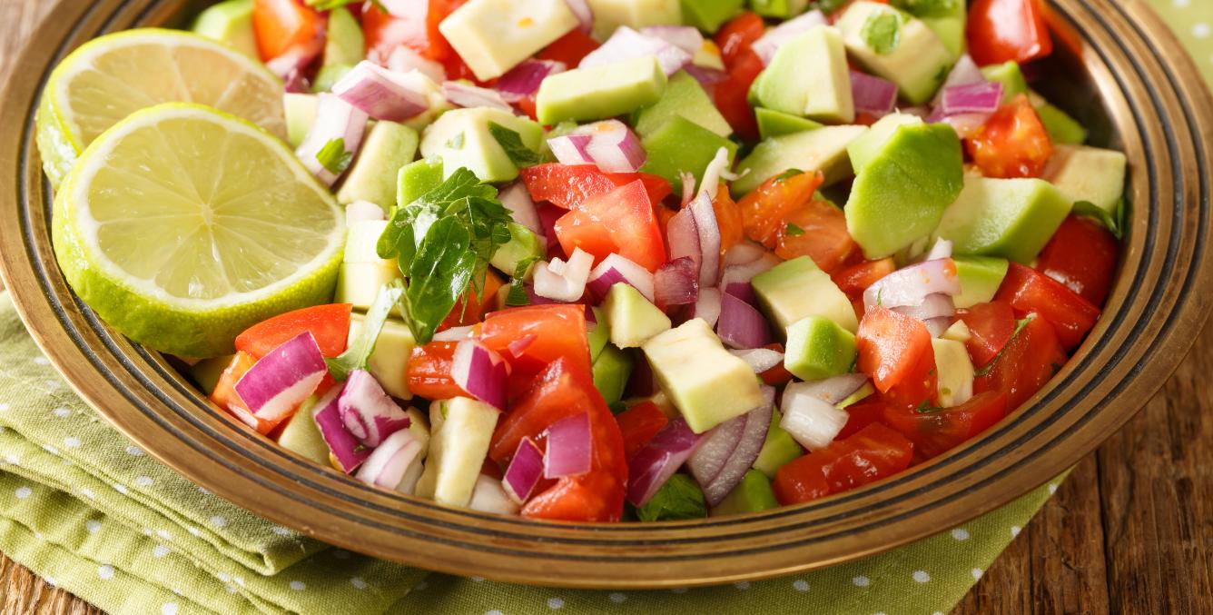 Tomato, cucumber and onion salad in a dish.