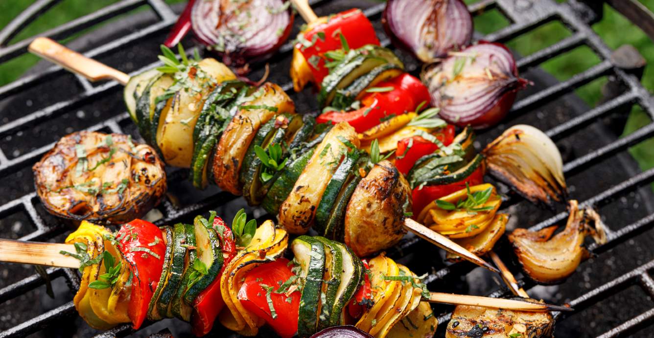 Vegetable skewers in a grill.