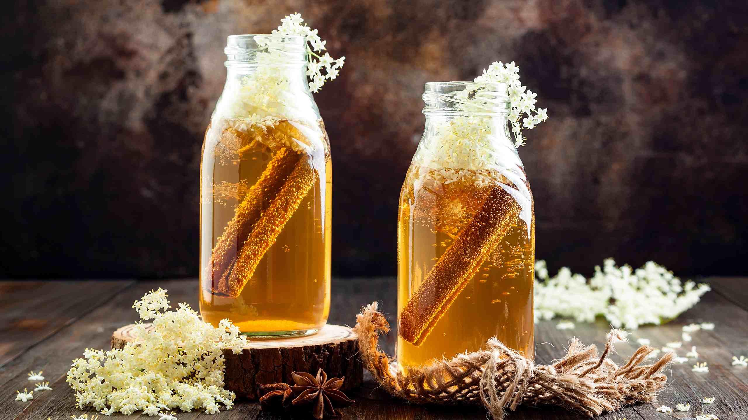 Two bottles of cinnamon and ginger kombucha, infused with elderflower.